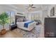 Comfortable main bedroom with tray ceiling, sitting area and large windows at 1115 Wynnbrook Way, Concord, NC 28027