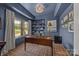 Stylish office with custom built-in shelves, tray ceiling and natural light at 1115 Wynnbrook Way, Concord, NC 28027