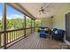Inviting screened porch with comfortable seating and scenic views of the lush green backyard at 1115 Wynnbrook Way, Concord, NC 28027