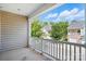 Enjoy a relaxing view from this large, covered balcony with white railings and a peek into the community at 11209 Lazio Ln # 1, Charlotte, NC 28277