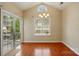 The dining room features hardwood flooring and a large sliding door leading to outdoor space at 11209 Lazio Ln # 1, Charlotte, NC 28277