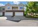 Charming townhome with two-car garage, balcony, and brick facade at 11209 Lazio Ln # 1, Charlotte, NC 28277