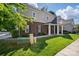 Brick and siding townhome featuring a covered front entrance at 11209 Lazio Ln # 1, Charlotte, NC 28277