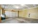 Spacious garage with concrete flooring and a large, modern sectional garage door. Good space for multiple cars at 11209 Lazio Ln # 1, Charlotte, NC 28277