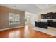 Open kitchen area with hardwood floors and modern black cabinetry at 11209 Lazio Ln # 1, Charlotte, NC 28277