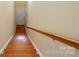 Wooden staircase leading to the upper level of the home at 11209 Lazio Ln # 1, Charlotte, NC 28277