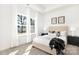 Bright bedroom featuring large windows, neutral decor, and carpet floors at 1129 Thayer Glen Ct, Charlotte, NC 28213