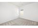 Bedroom with carpet features white walls, a window and a door to another room at 1129 Thayer Glen Ct, Charlotte, NC 28213