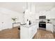 Modern kitchen boasts white cabinets, granite countertops, and stainless steel appliances at 1129 Thayer Glen Ct, Charlotte, NC 28213