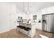 Bright kitchen with stainless steel appliances, granite countertops, and breakfast bar seating at 1129 Thayer Glen Ct, Charlotte, NC 28213