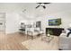 Open-concept living space with modern furnishings and views of the kitchen at 1129 Thayer Glen Ct, Charlotte, NC 28213
