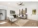 Cozy living room featuring hardwood floors, neutral decor, and an open layout at 1129 Thayer Glen Ct, Charlotte, NC 28213