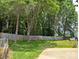 Landscaped backyard featuring a privacy fence and lush green grass and mature trees at 117 Blackberry Ln # 66, Mooresville, NC 28117
