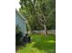 Spacious backyard featuring a lush lawn, mature trees, and a privacy fence that creates a serene outdoor oasis at 117 Blackberry Ln # 66, Mooresville, NC 28117