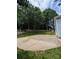 Spacious backyard featuring a concrete patio, grassy lawn, and a light blue house at 117 Blackberry Ln # 66, Mooresville, NC 28117