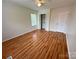 Well-lit bedroom with wood flooring, a closet, and a ceiling fan providing comfort at 117 Blackberry Ln # 66, Mooresville, NC 28117