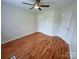 Bedroom with ceiling fan, two closets, neutral paint and hardwood flooring at 117 Blackberry Ln # 66, Mooresville, NC 28117
