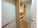 Walk-in closet featuring custom wood shelving, organizers, and metal rods for hanging clothes and storage at 117 Blackberry Ln # 66, Mooresville, NC 28117