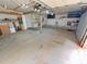 Spacious garage with storage shelving, peg board, and concrete flooring at 117 Blackberry Ln # 66, Mooresville, NC 28117