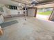 Open garage space with concrete flooring and pegboard wall, offering ample room for parking at 117 Blackberry Ln # 66, Mooresville, NC 28117