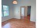 Open floorplan living room with hardwood floors, neutral walls, and natural light at 117 Blackberry Ln # 66, Mooresville, NC 28117