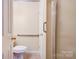 A bathroom featuring a toilet and shower with accessibility features, ensuring comfort and safety at 1184 Cambridge Dr, Shelby, NC 28152