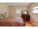 Comfortable bedroom features warm wood floors, bright windows, and lovely wooden furniture at 1184 Cambridge Dr, Shelby, NC 28152