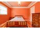 This charming bedroom features warm-toned walls, hardwood floors, and a classic chandelier at 1184 Cambridge Dr, Shelby, NC 28152