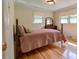 Cozy bedroom featuring wood floors, two windows for natural light, and neutral colored walls at 1184 Cambridge Dr, Shelby, NC 28152