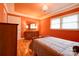 A cozy bedroom showcasing a wooden bed frame, dresser, and a view of a window with lots of natural light at 1184 Cambridge Dr, Shelby, NC 28152