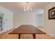 Bright dining room featuring hardwood floors, a chandelier, and ample space for entertaining at 1184 Cambridge Dr, Shelby, NC 28152