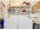 Functional laundry room with washer, dryer, and shelving for storage at 1184 Cambridge Dr, Shelby, NC 28152