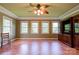 Spacious living room with hardwood floors, large windows, and ceiling fan at 1184 Cambridge Dr, Shelby, NC 28152