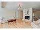 Comfortable living room with a white brick fireplace, chandelier, and ample natural light at 1184 Cambridge Dr, Shelby, NC 28152