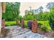 Outdoor patio area with brick pillars and a decorative wrought iron fence at 1184 Cambridge Dr, Shelby, NC 28152