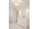 Bright bathroom featuring a double sink vanity, walk-in shower, and marble-like tiling, with a white and clean finish at 1184 Thornwell Ave, Rock Hill, SC 29732