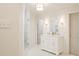 Bright bathroom featuring a double sink vanity, walk-in shower, and marble-like tiling, with a white and clean finish at 1184 Thornwell Ave, Rock Hill, SC 29732