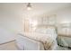 Bright bedroom features neutral decor and a comfortable bed with decorative pillows and floral-patterned throw at 1184 Thornwell Ave, Rock Hill, SC 29732