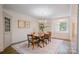 Bright dining room featuring hardwood floors, a chandelier, and a built-in china cabinet at 1184 Thornwell Ave, Rock Hill, SC 29732