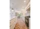 Bright kitchen showing the island, range, and adjacent dining area with herringbone flooring at 1184 Thornwell Ave, Rock Hill, SC 29732