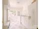Bright laundry room features shaker cabinets, stainless appliances, and stylish tile floors at 1184 Thornwell Ave, Rock Hill, SC 29732
