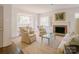 Bright living room features a cozy fireplace, neutral tones, and ample seating at 1184 Thornwell Ave, Rock Hill, SC 29732