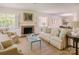 Bright living room features a cozy fireplace, neutral tones, and ample seating at 1184 Thornwell Ave, Rock Hill, SC 29732