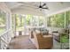 Relaxing screened porch with comfortable seating, ceiling fan, and backyard view at 1184 Thornwell Ave, Rock Hill, SC 29732