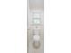 Bright bathroom with a clean white toilet situated next to a window, featuring marble-like tiling and natural light at 1184 Thornwell Ave, Rock Hill, SC 29732