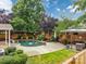 Beautiful backyard featuring a fenced pool area, landscaping, and a cabana at 1225 Madison Green Dr, Fort Mill, SC 29715