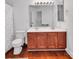 Bathroom featuring double vanity, wood cabinets, framed mirror, and shower with polka dot curtain at 1225 Madison Green Dr, Fort Mill, SC 29715