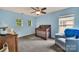 Bedroom featuring blue walls, carpet, and a wooden crib at 1225 Madison Green Dr, Fort Mill, SC 29715