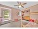 Bedroom featuring pink walls, a wooden frame bed, and carpet at 1225 Madison Green Dr, Fort Mill, SC 29715