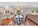 Dining area with hardwood floors and access to an outdoor pool at 1225 Madison Green Dr, Fort Mill, SC 29715